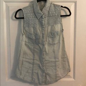 Sleeveless light blue jean button down shirt